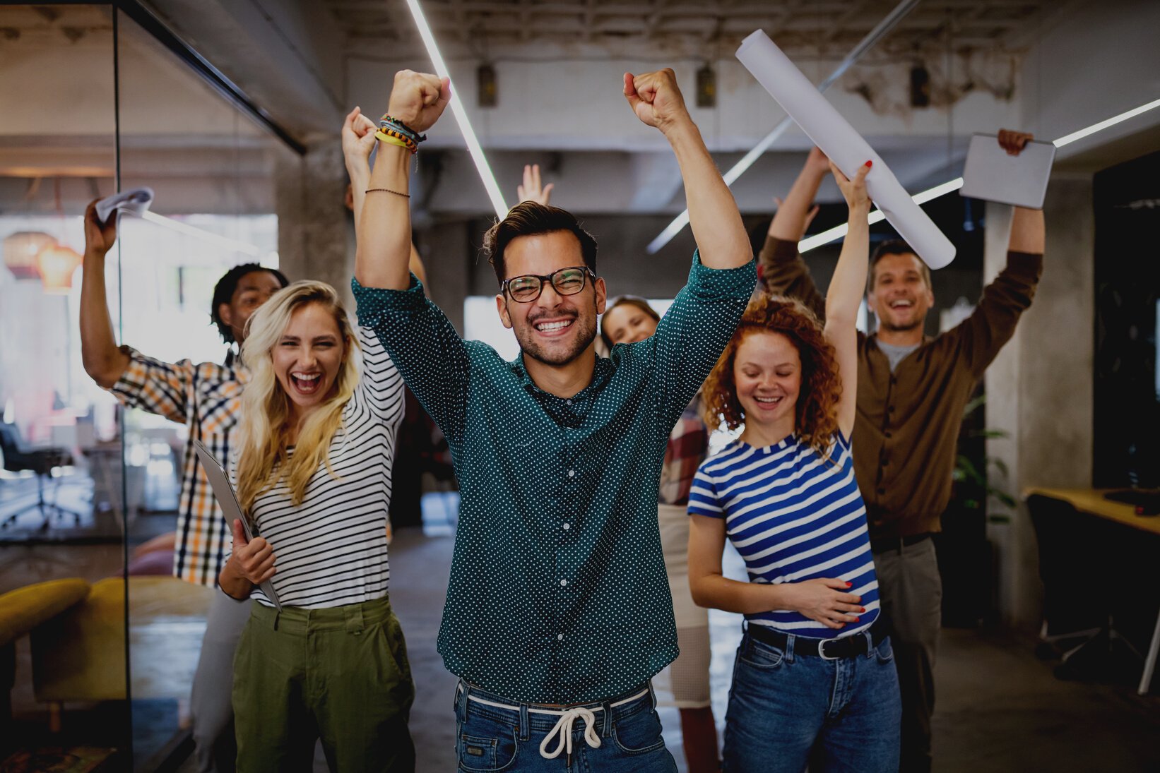 Successful company with happy employees in modern office